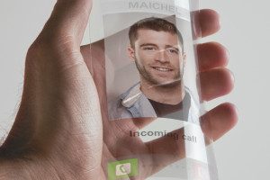 Hand holding transparent future mobile phone made of graphene. C