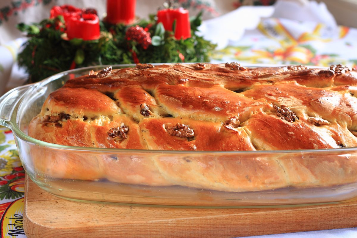 Traditional Czech Christmas cake with candles in the background